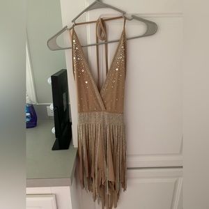 Nude romper with rhinestones. Never worn, tag on.
